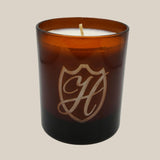 unlit fall winter candle in branded vessel
