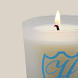 lit laundry room candle in branded vessel 