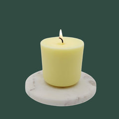 winter candle refill on marble slab