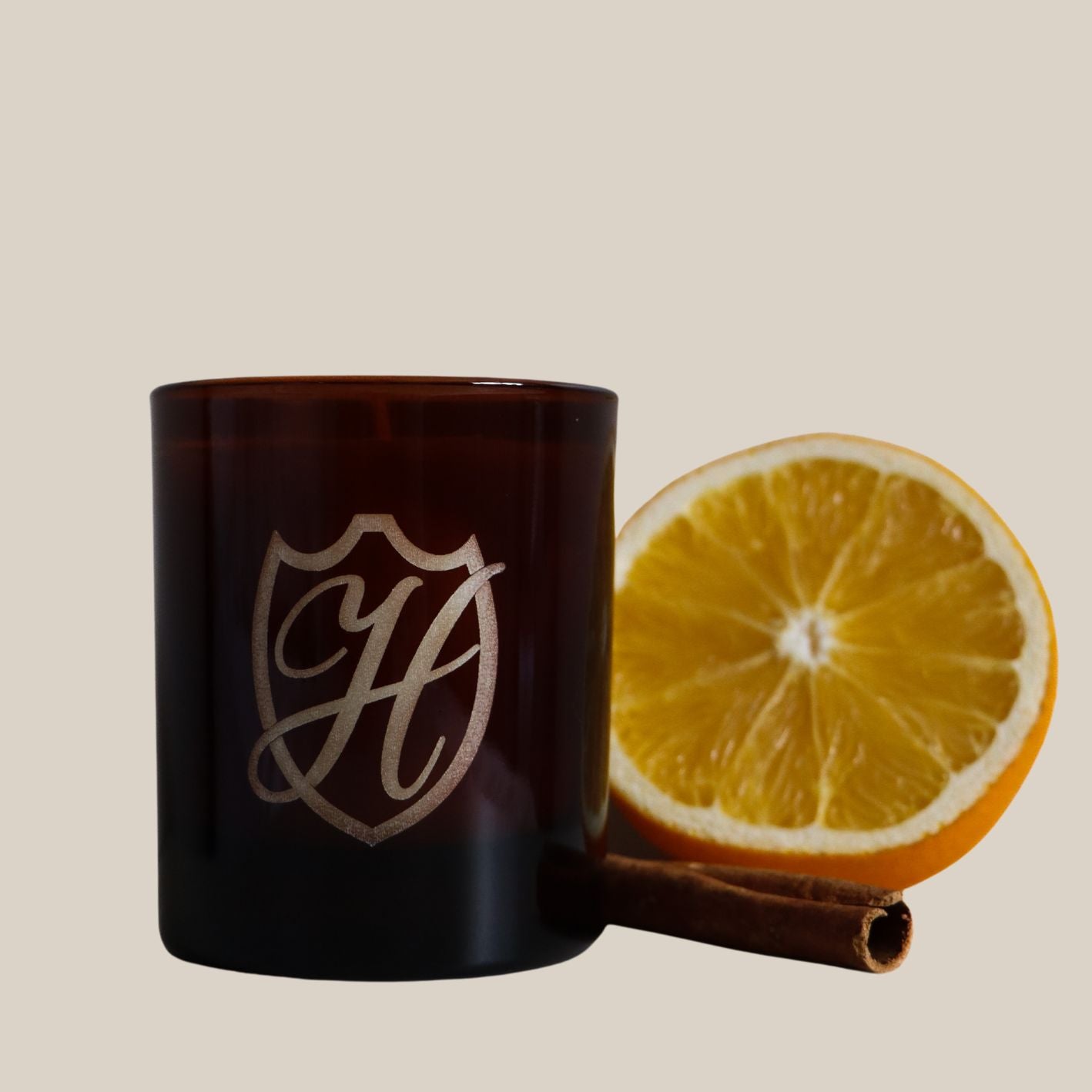 winter candle vessel with orange and cinnamon stick
