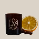 winter candle vessel with orange and cinnamon stick
